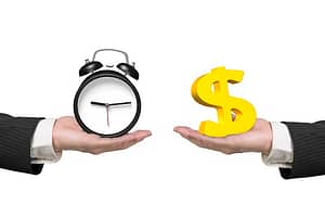One hand holding a clock, and another hand holding a dollar sign to represent subscription versus one-time payment.